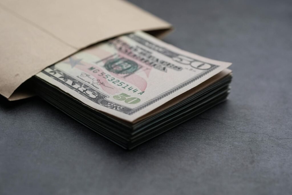 Organized household bills and envelopes on a table