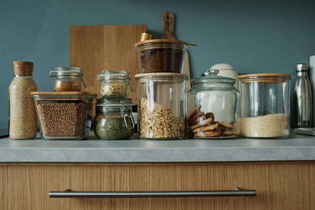 Meal prep containers and ingredients on a kitchen counter