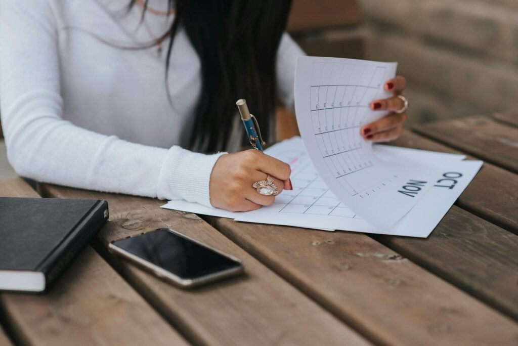 Hands crossing out items on a subscription list