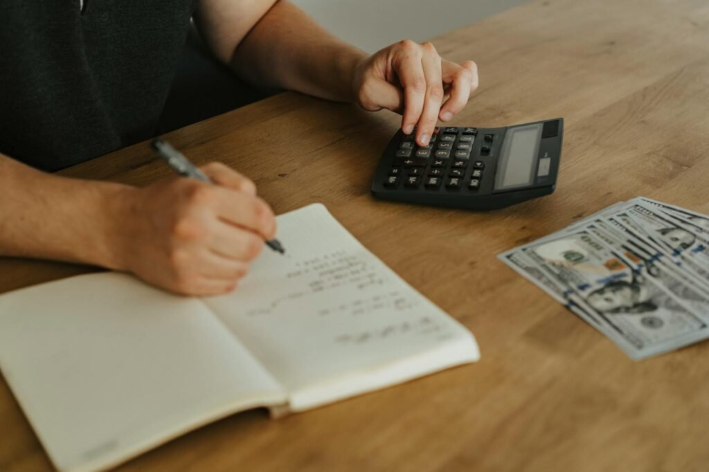 Budgeting notebook and calculator on a desk