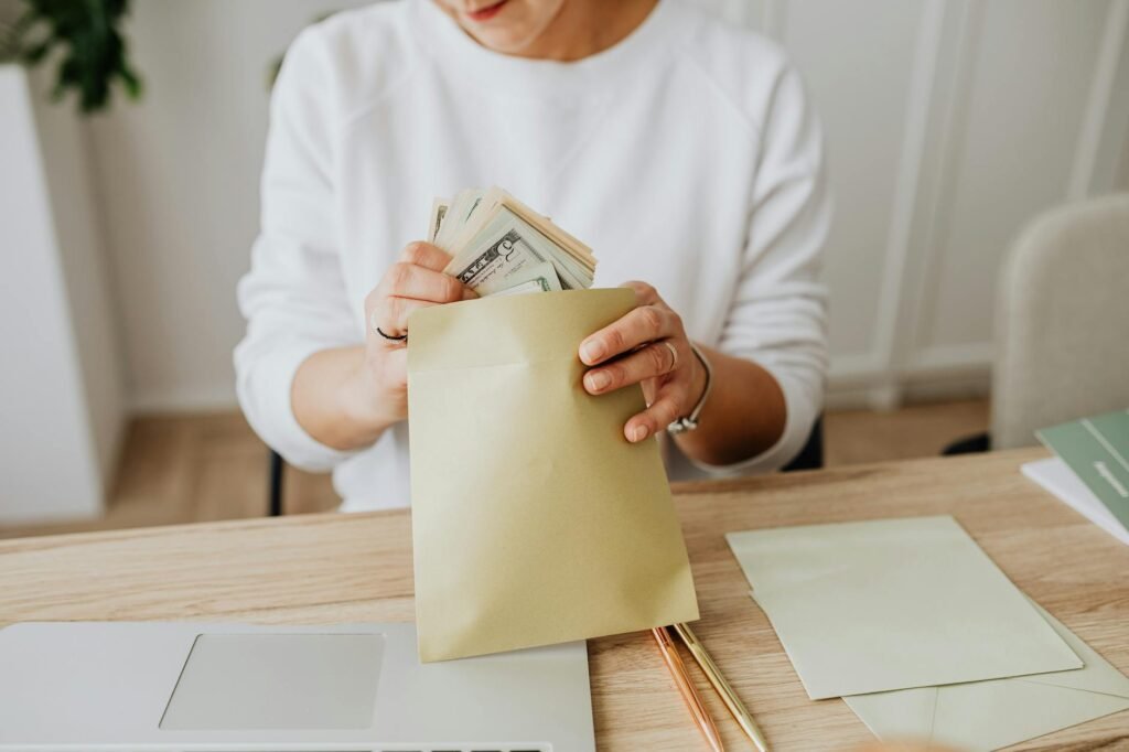 Two envelopes on a desk representing different savings goals