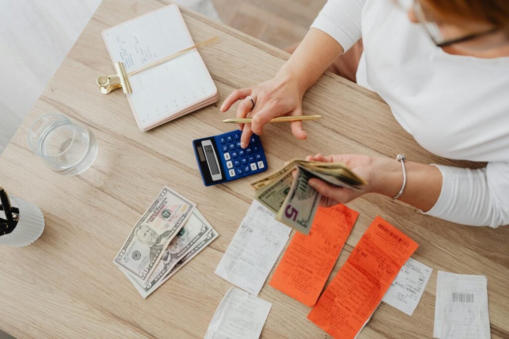 Grocery receipt next to a handwritten monthly spending plan
