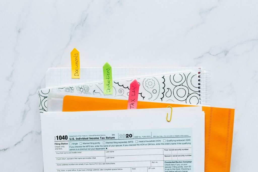 A monthly calendar with paydays and bill due dates marked in a budgeting workspace