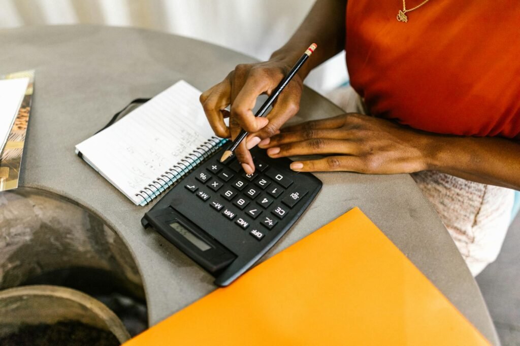 Budget notebook and calculator on a clean desk