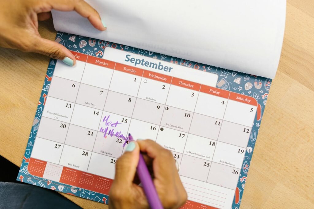 Calendar with bill due dates being written in