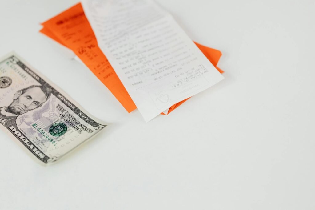 Receipts and a worksheet used to review monthly spending