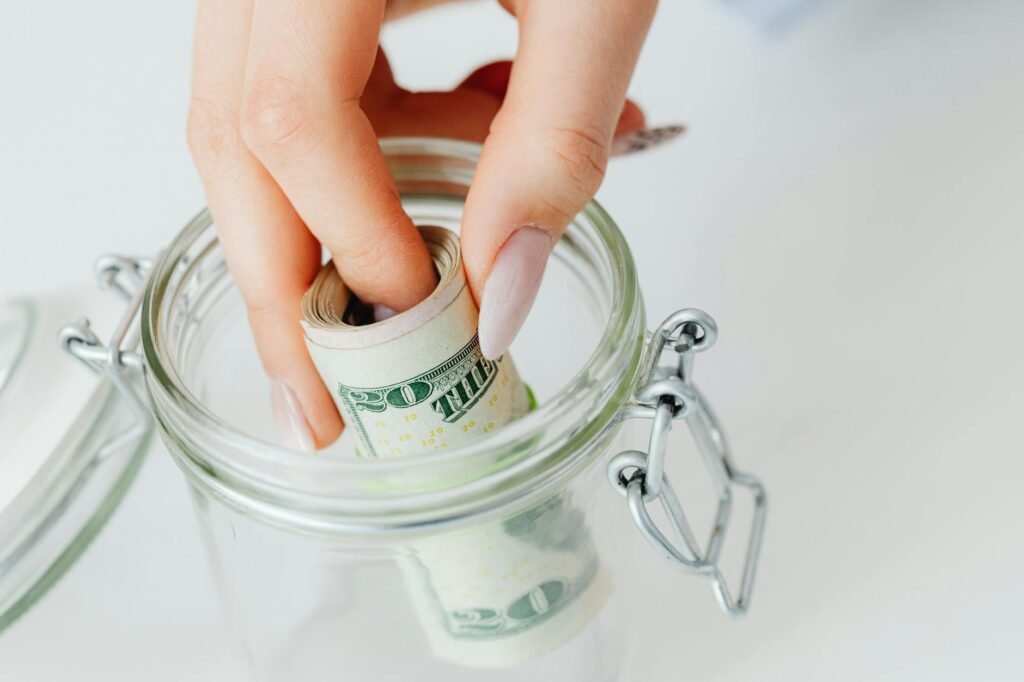 Savings jar and budgeting notebook on an organized workspace