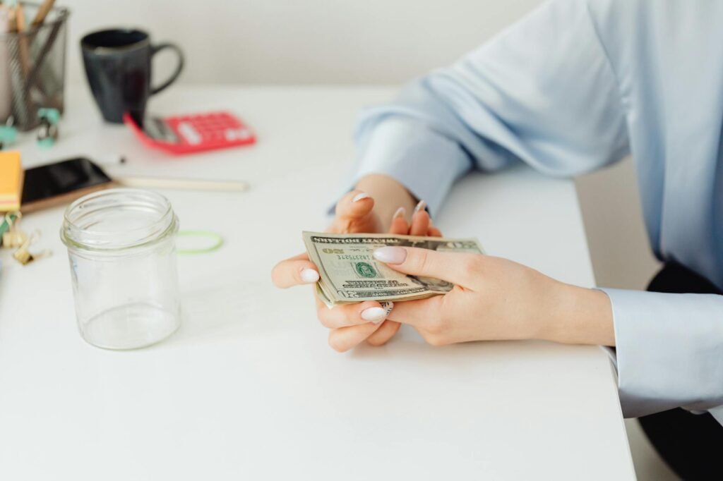 Person using a phone to set up an automatic savings transfer