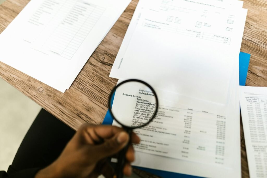 A person checking recurring charges on account statements at home