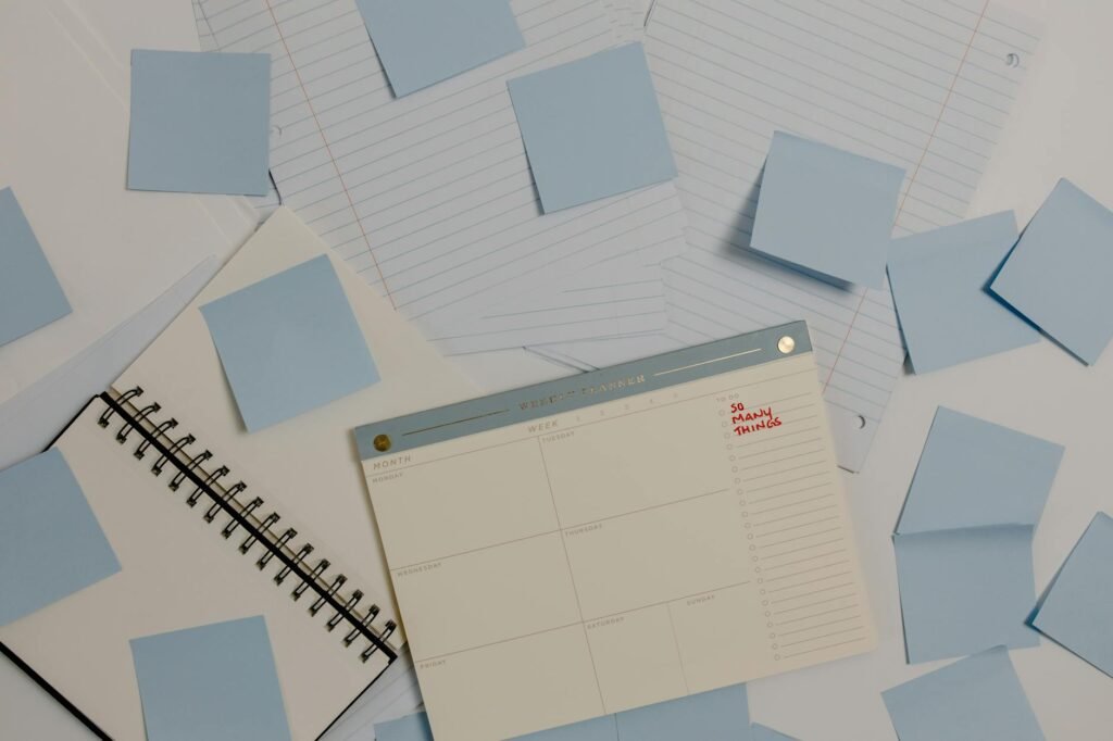 Calendar on a desk with a sticky note listing no-spend rules