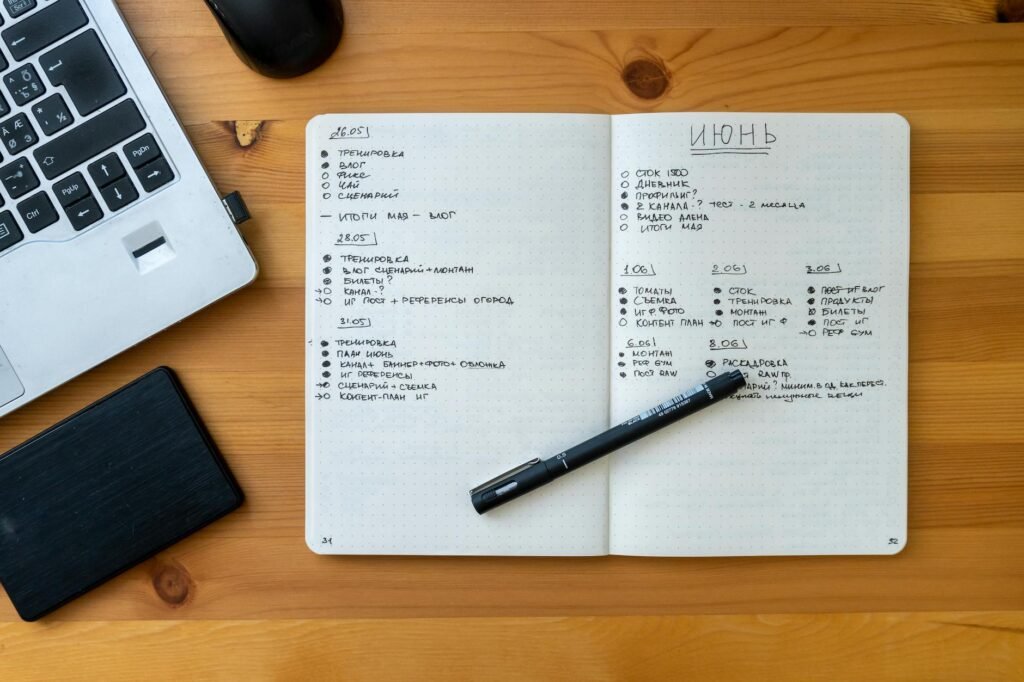 A notebook page with a handwritten wish list and prices for future purchases