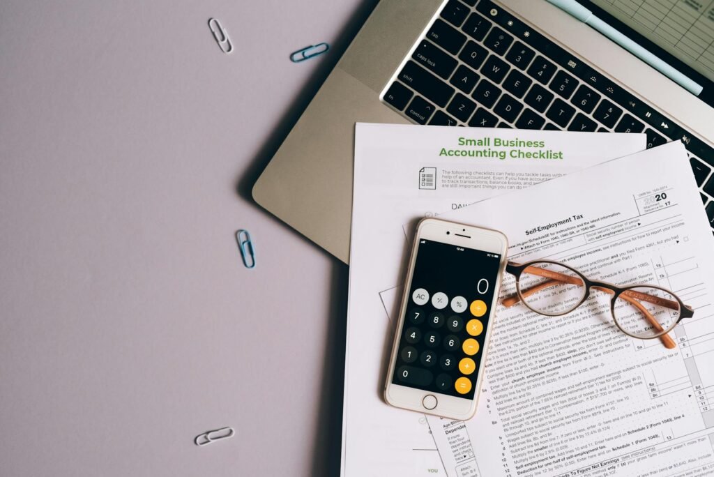 Calculator and simple budget worksheet on a tidy desk