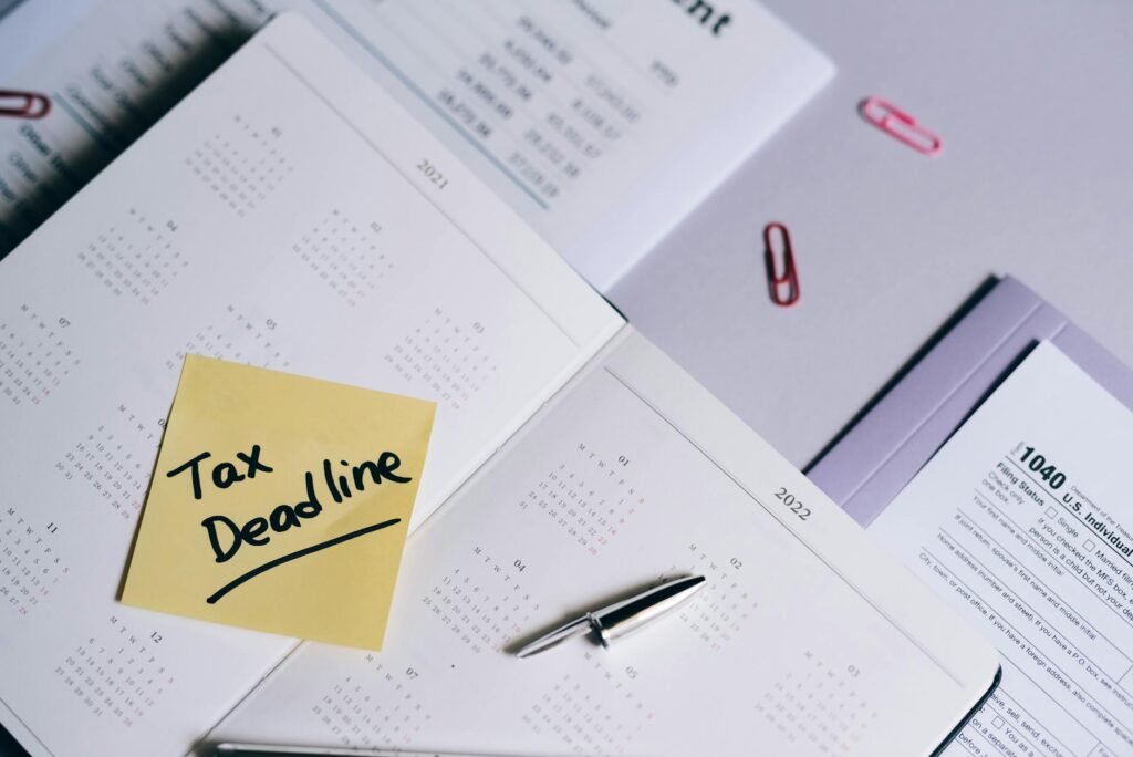 A calendar with bill due dates marked in pen